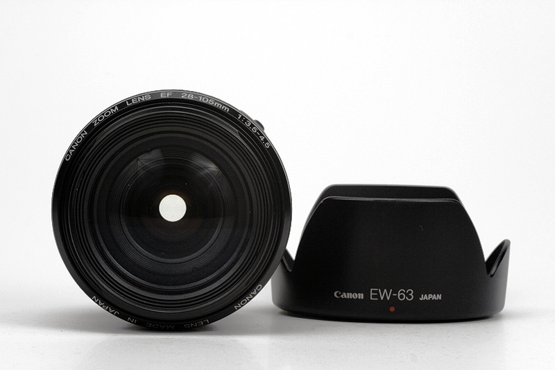 Canon EF 28-105mm F3.5-4.5 USM Front Lens View showing model name inscription, with lens hood EW-63