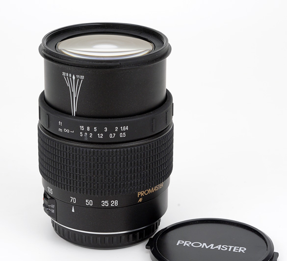 Promaster AF 28-105mm F4-5.6 for Canon EF Side View showing zoom and focusing scales and full extension