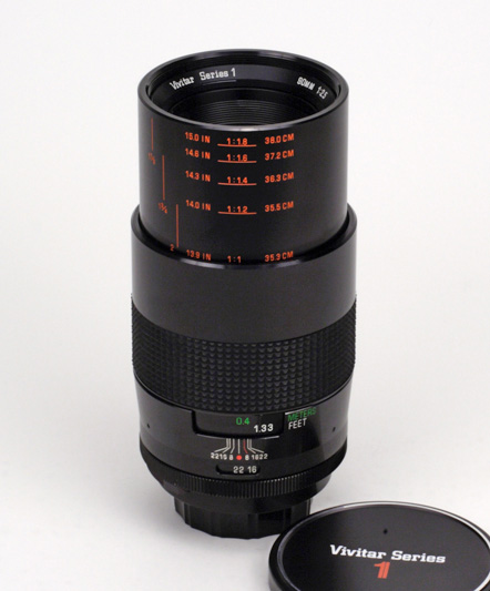 Vivitar MF 90mm F2.5 VMC Macro Series 1 Side View showing full focus extension, original lens cap, aperture and focus scales